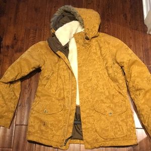 Burton yellow ski or snowboard jacket.